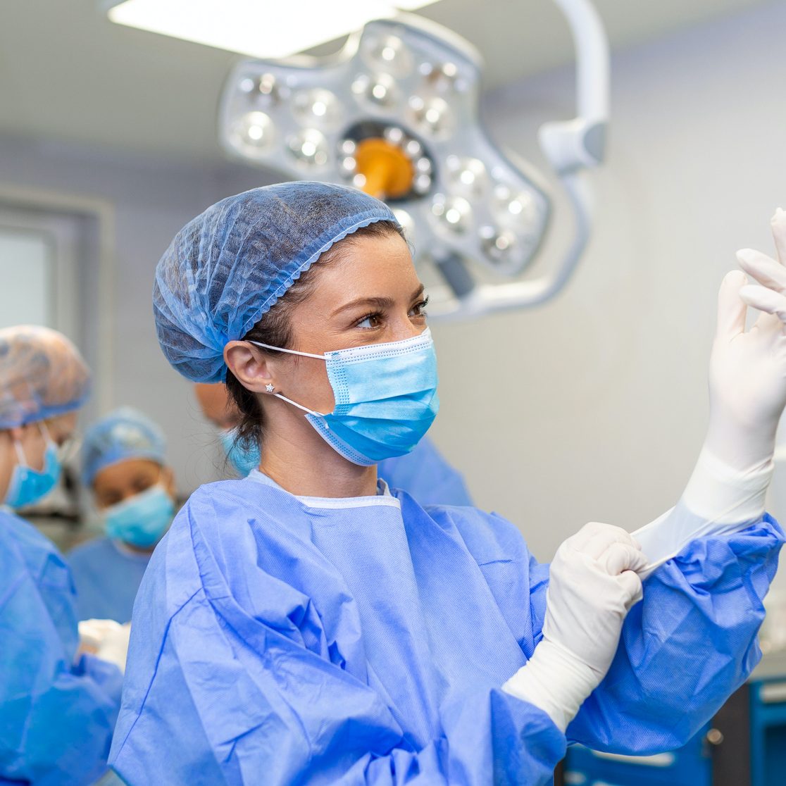 small animal surgeon in theatre preparing for spinal surgery